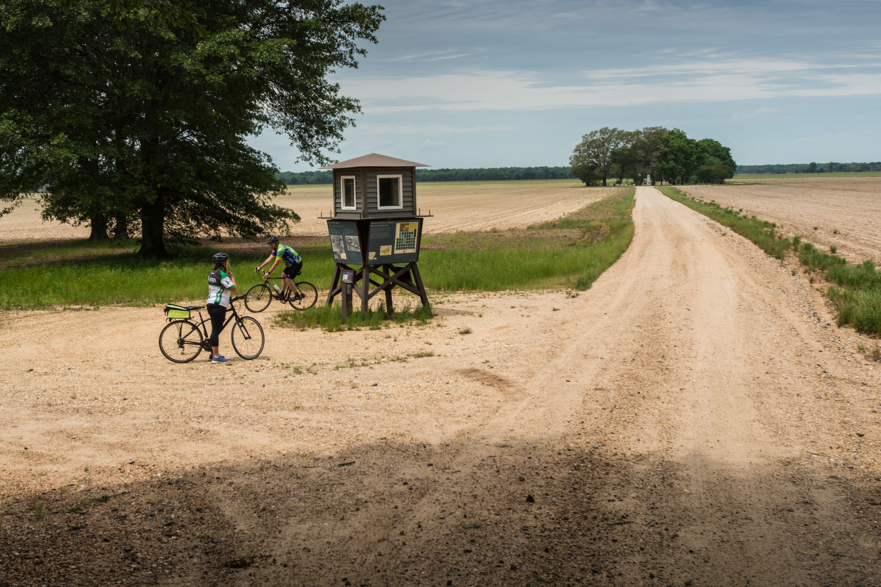 gravel bikers stopping for a rest on a gravel road