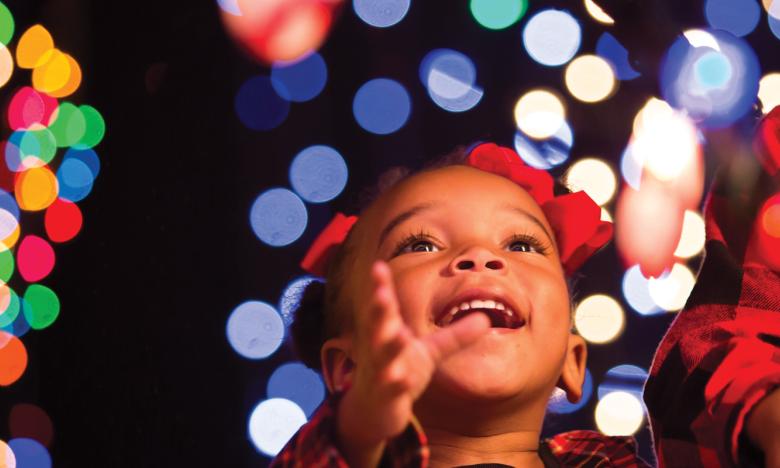 Girl admiring holiday lights