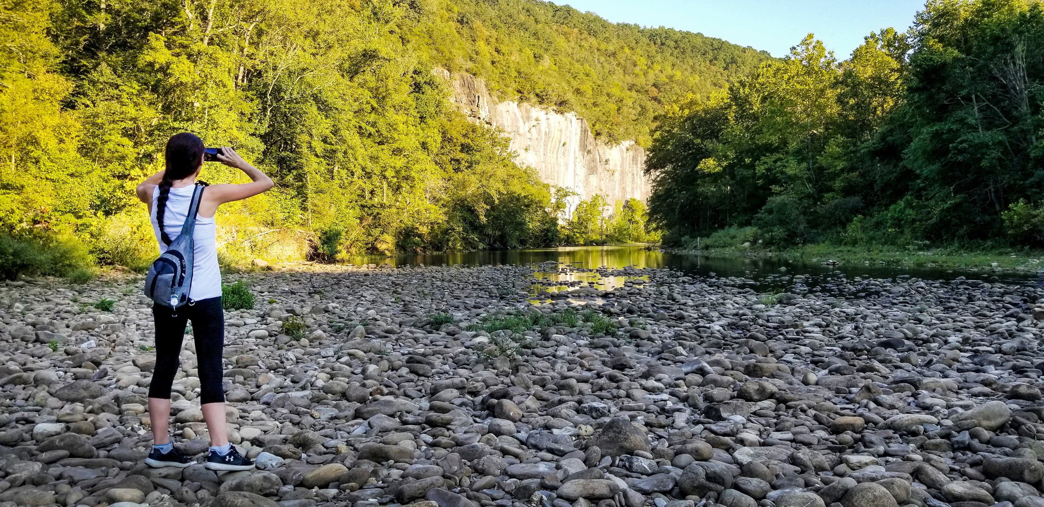 Woman looks out onto the shore of the Buffalo National River