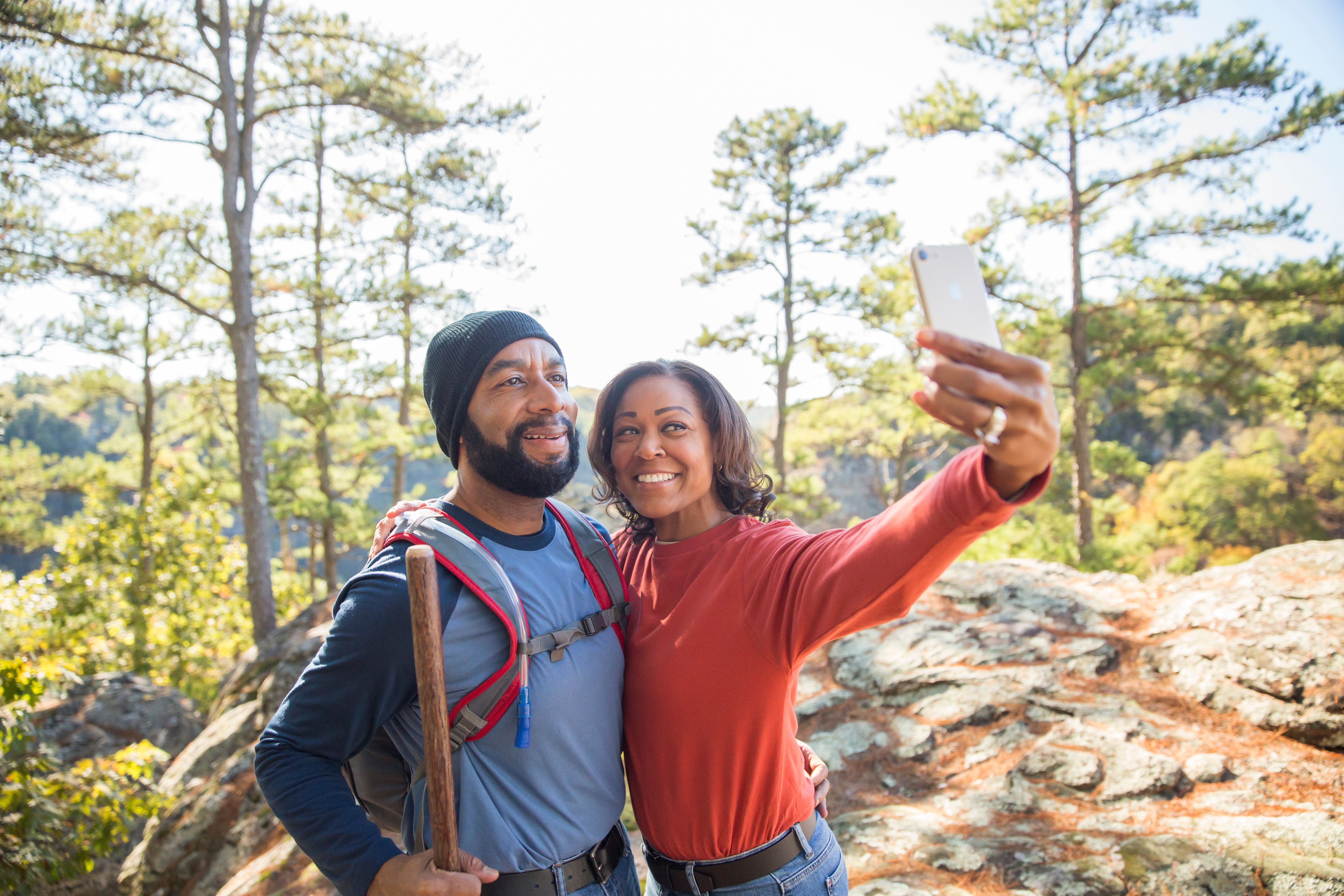 A couple takes a photo at Petit Jean State Park.