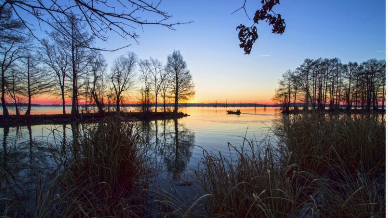 sunset over a lake in AR