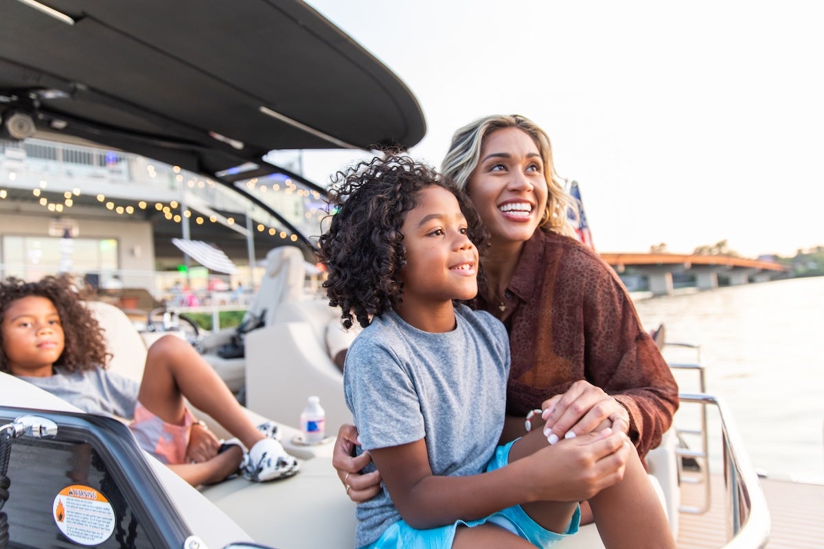 family smiling at lake hamilton