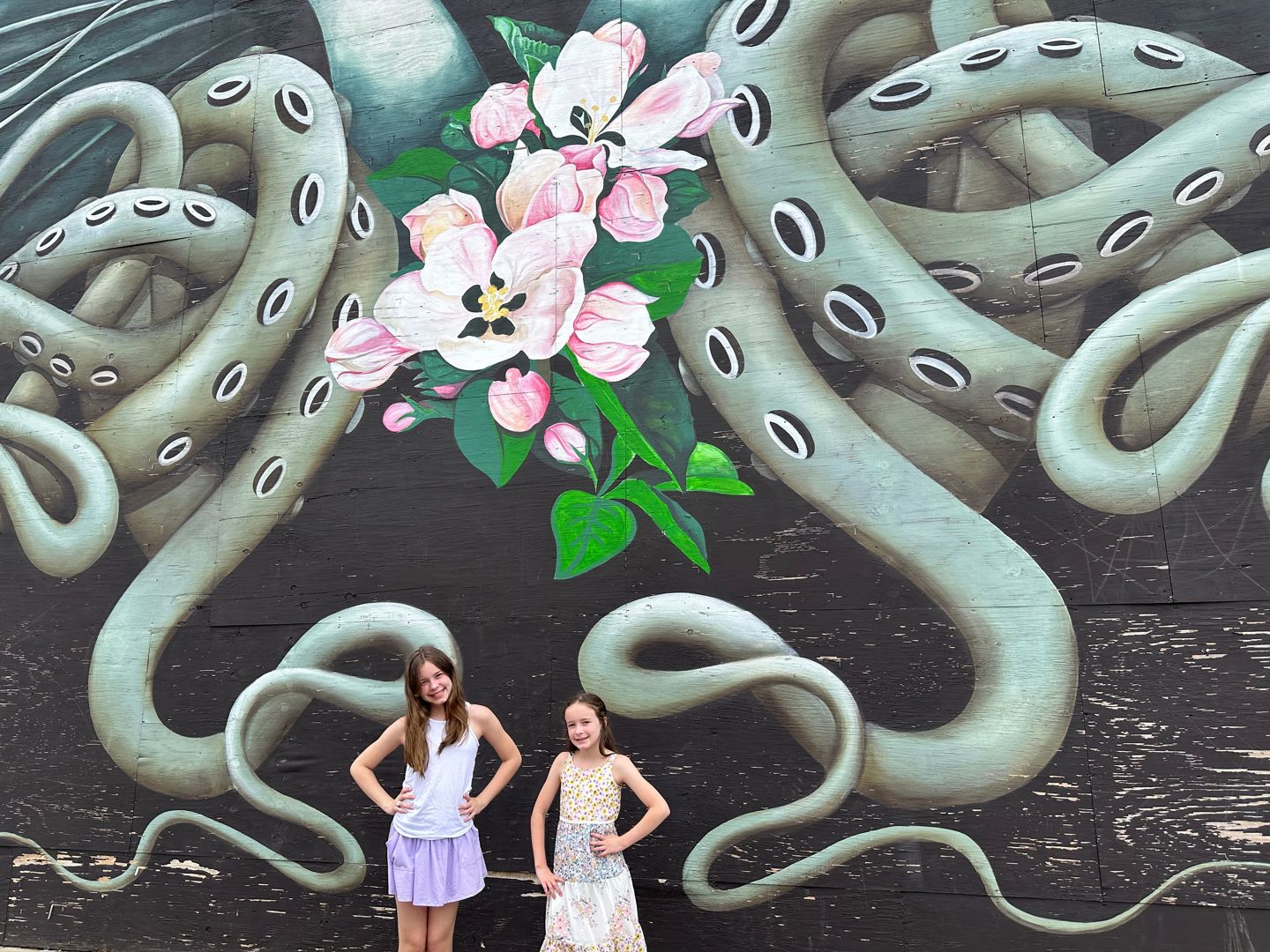 Kids in front of a mural in Fort Smith