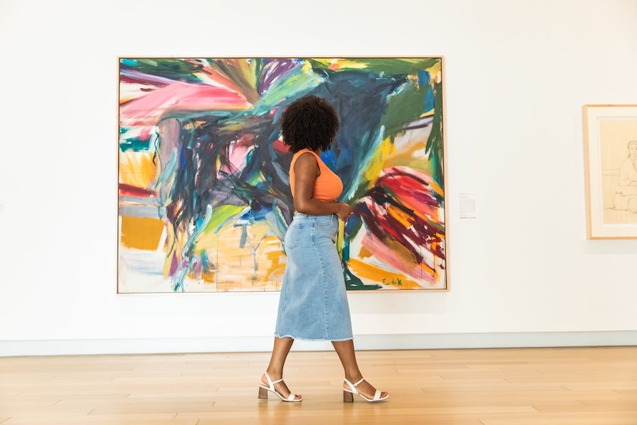 Lady walking in gallery