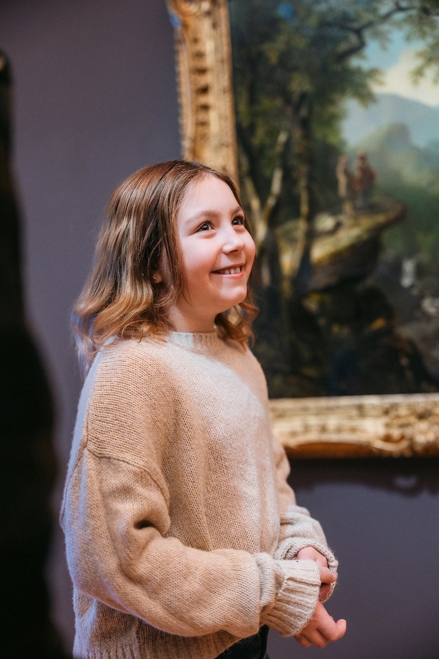 girl smiling in art museum