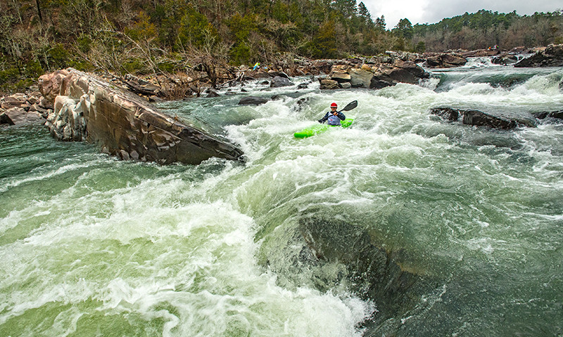 A kayaker paddles through the whitewater rapids on the Cossatot River in Arkansas.