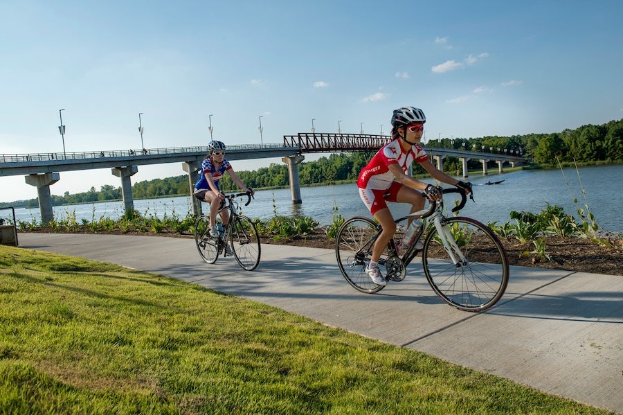 two women cycling near the Arkansas River