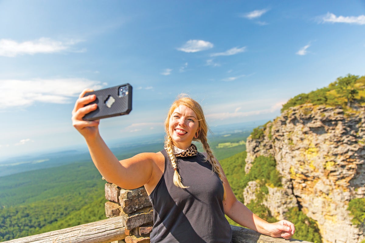Staci takes a selfie at an overlook at Mount Magazine State Park