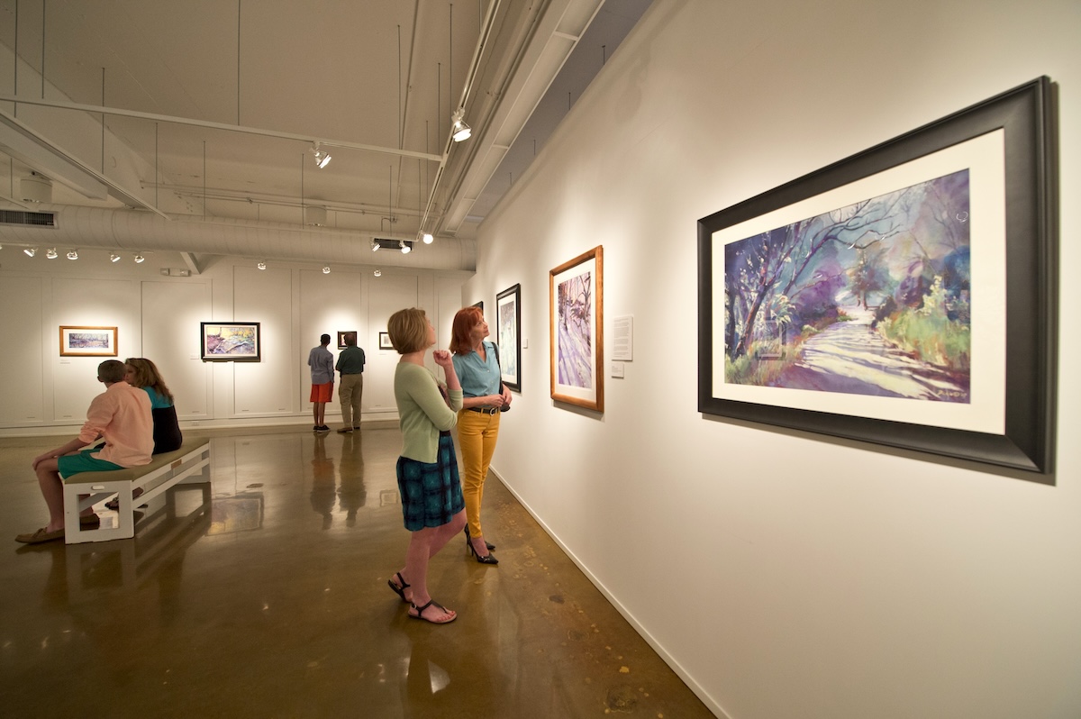 women viewing art in a gallery