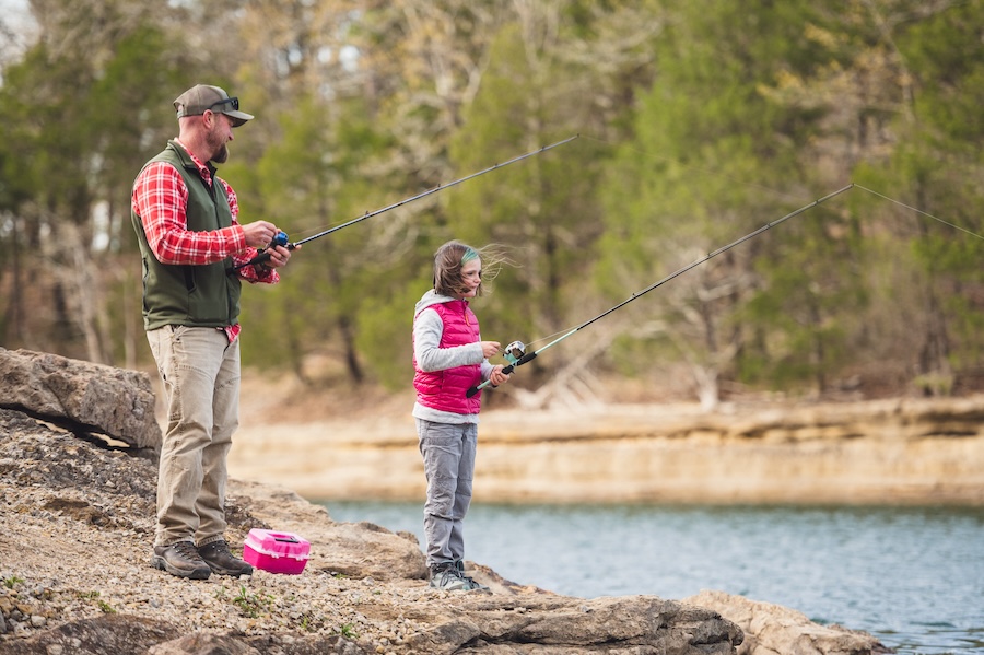 Family fishing on the banks of Beaver Lake