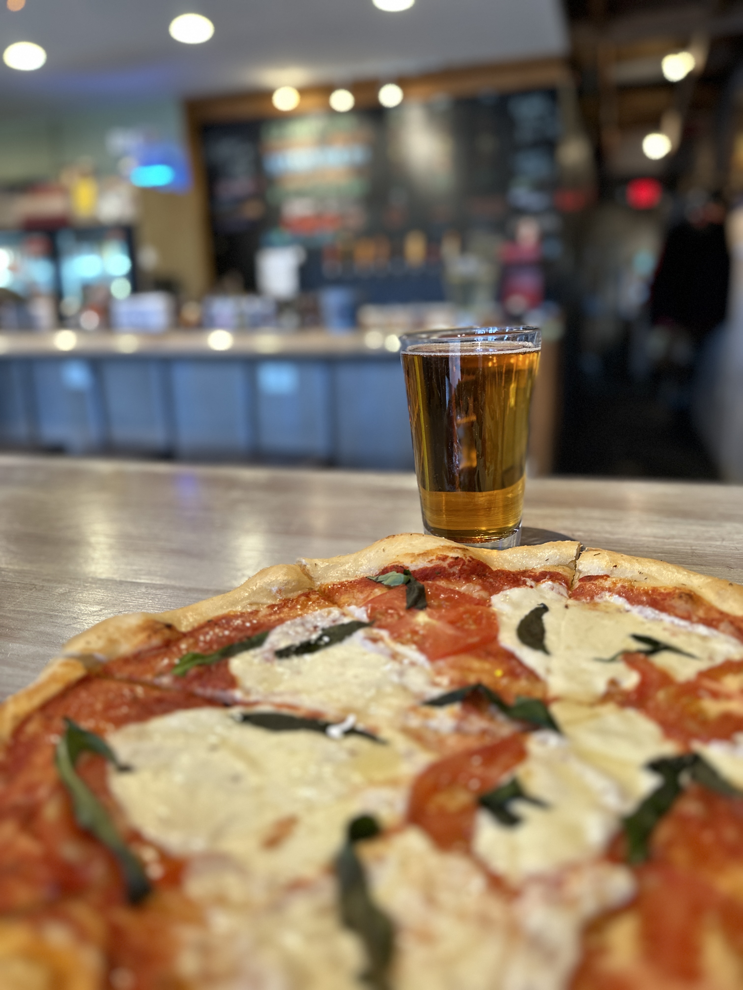 A margherita pizza and a craft beer from Norfork Brewing Company in Arkansas.
