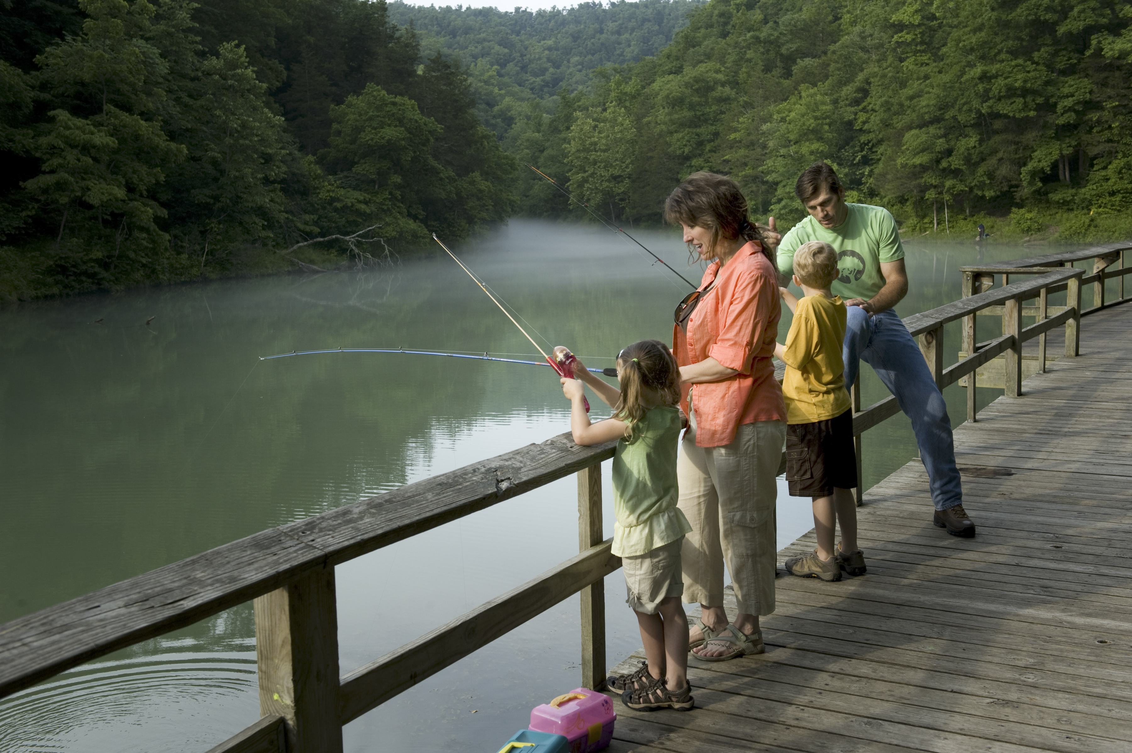 A family fishing on Mirror Lake in Arkansas
