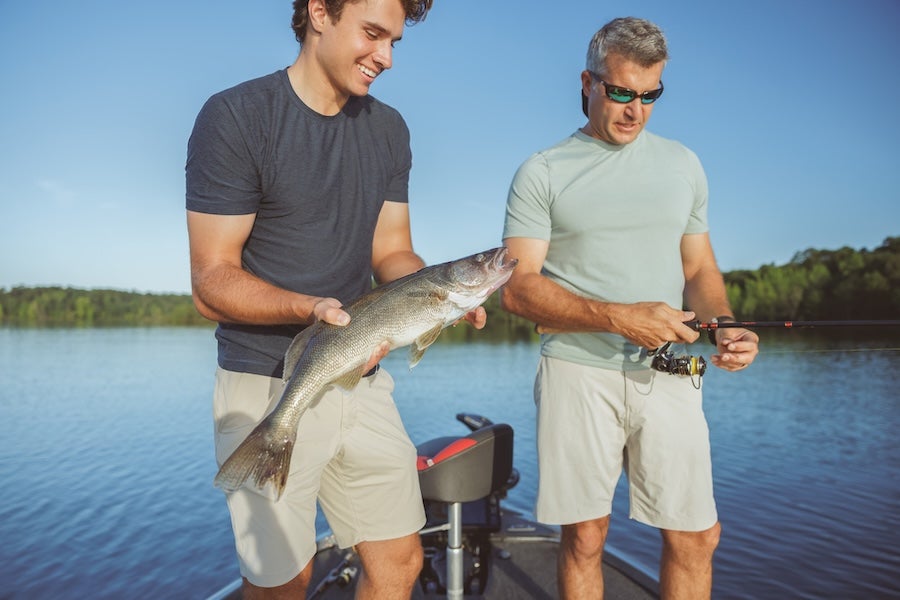 men fishing on the lake