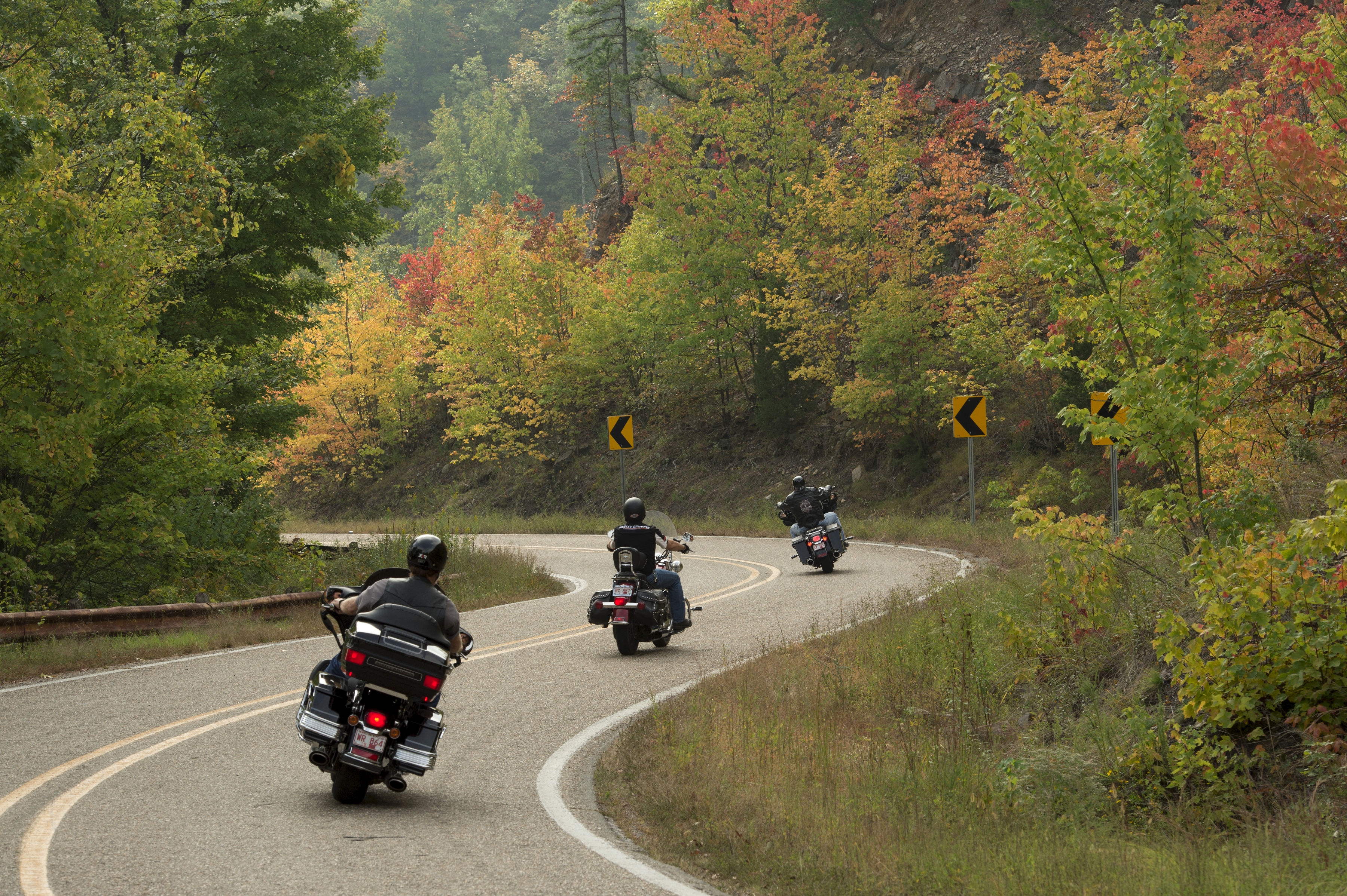 Motorcyclists ride up the Talimena Scenic Byway during fall