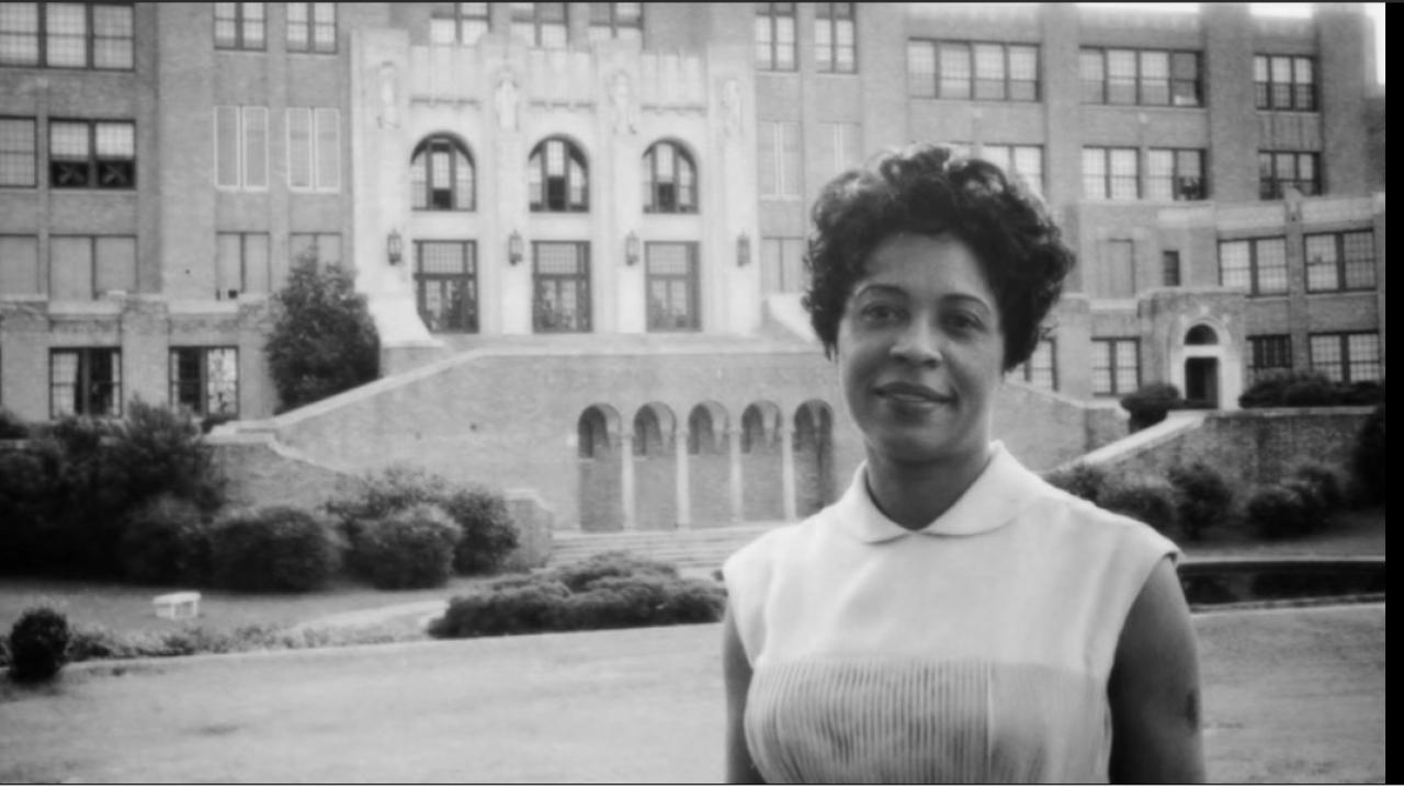 Daisy Bates in front of Little Rock Central High School 