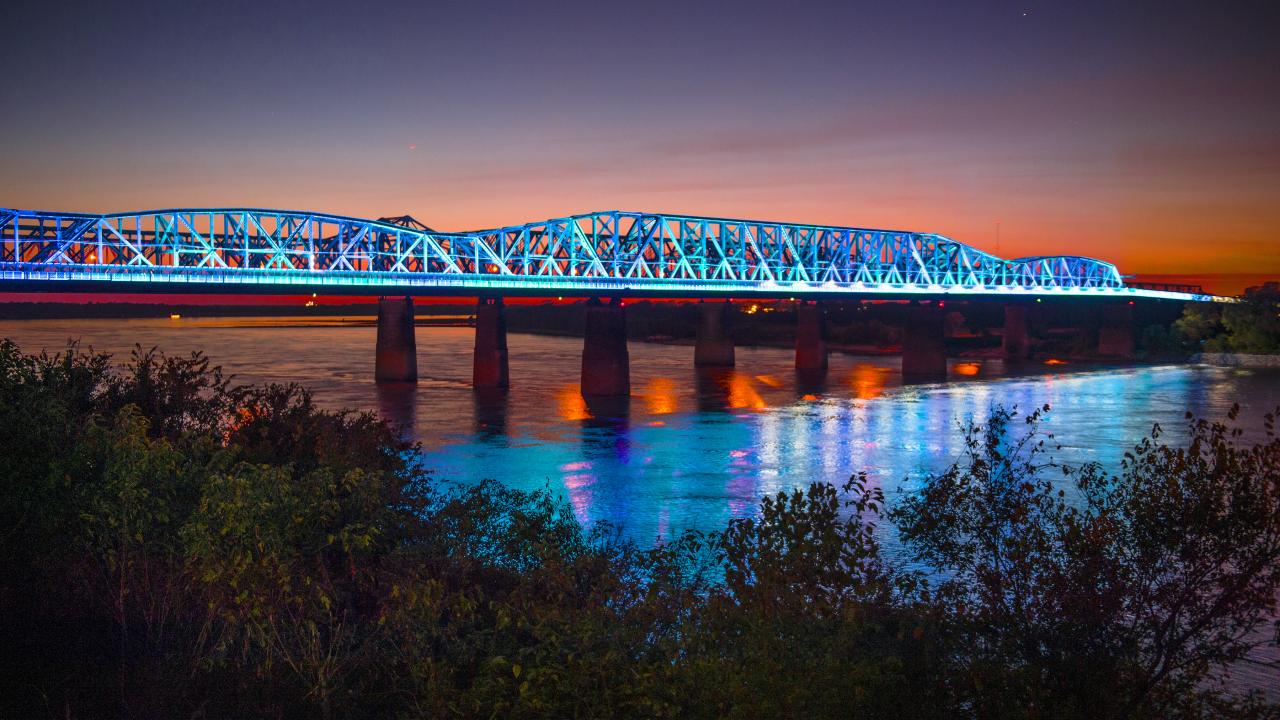 The Big River Crossing lights up the Mighty Mississippi.