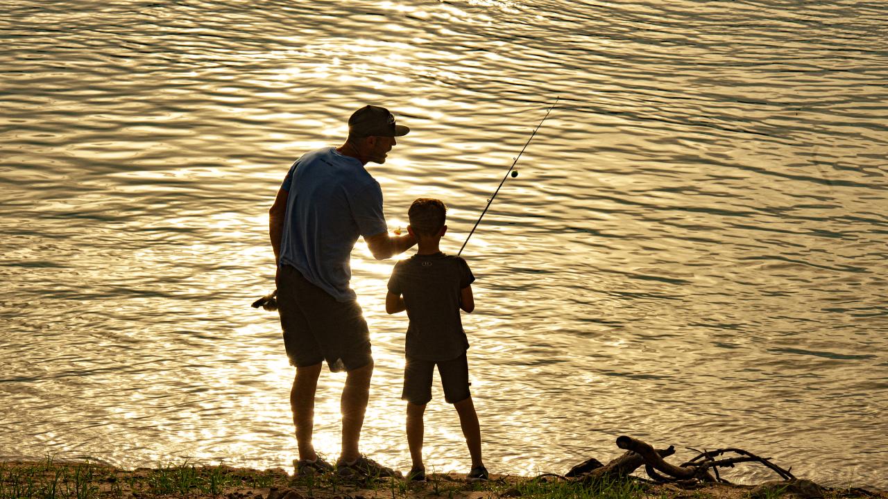 A father and son bank fishing in Arkansas