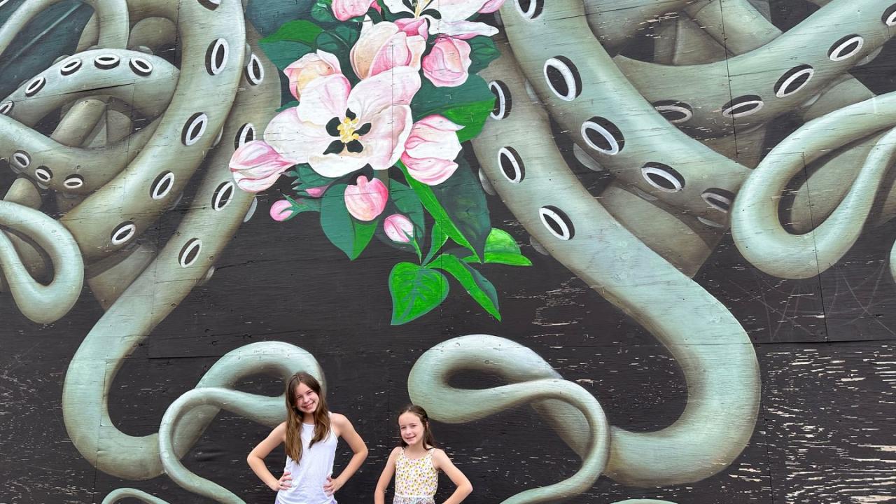 Kids in front of a mural in Fort Smith