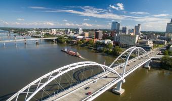 A skyline view of Little Rock overlooking the Broadway Bridge.