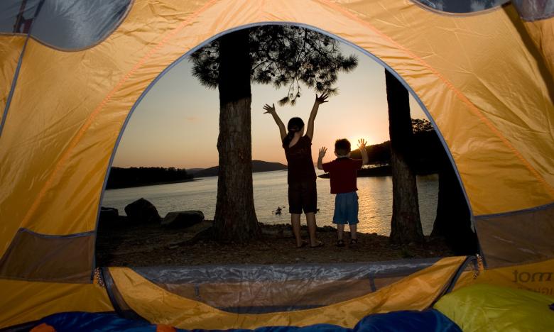 Children in front of a tent at Lake Ouachita. 