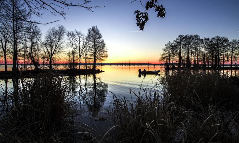 Fishing at sunset off Lawrence Landing on Lake Conway