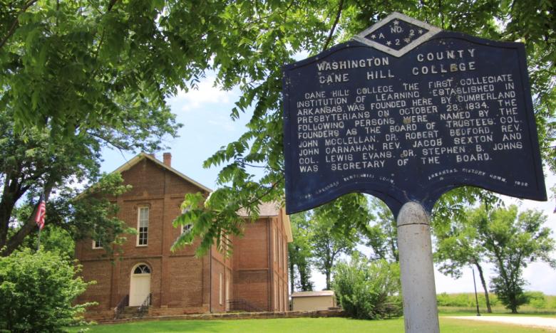 The sign outside the Washington County Cane Hill College reads: Cane Hill College was the first collegiate institution of learning established in Arkansas and was founded here by Cumberland Presbyterians on October 28, 1834. The following persons were named by the founders as the board trustees: Col. John McClellan, Dr. Robert Bedford, Rev. Jon Carnahan, Rev. Jacob Sexton and Col. Lewis Evans. Dr. Stephen B. Johns was the Secretary of the Board.