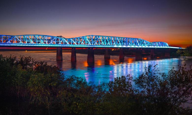 The Big River Crossing lights up the Mighty Mississippi.
