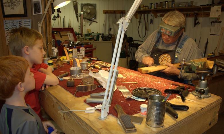 Boys watching the woodworker at Ozark Folk Center