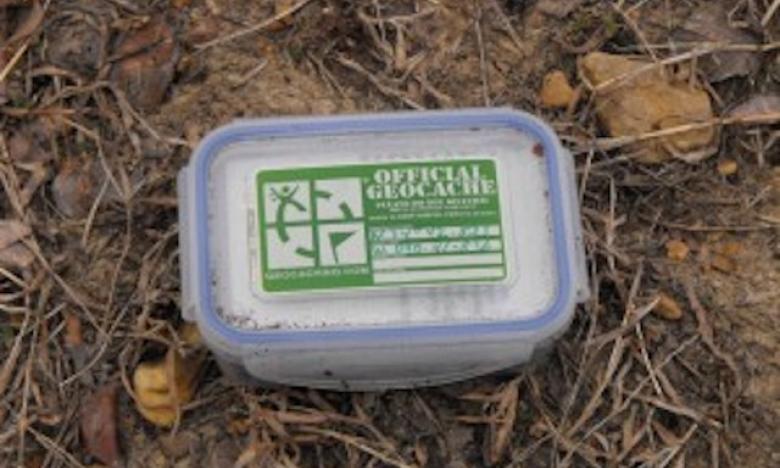 Small geocache container in the forests of Arkansas
