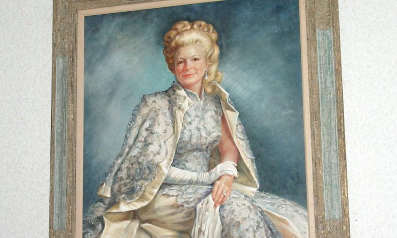A painting of Martha Mitchell inside her childhood home. 