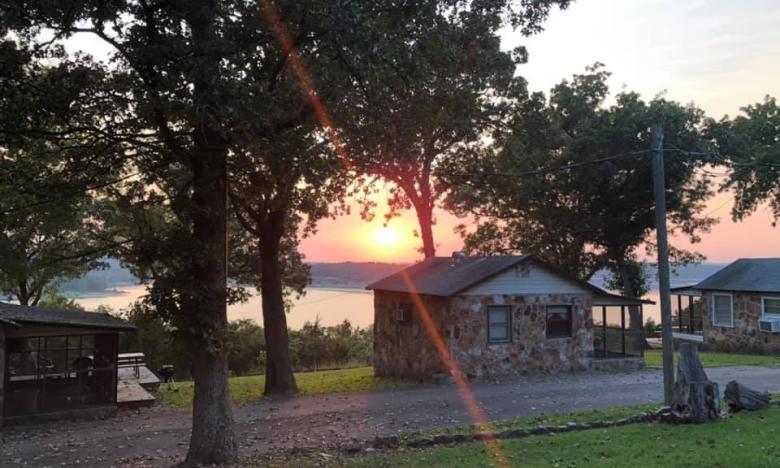 A sunset view from a cabin at Three Oaks Resort on Norfork Lake.