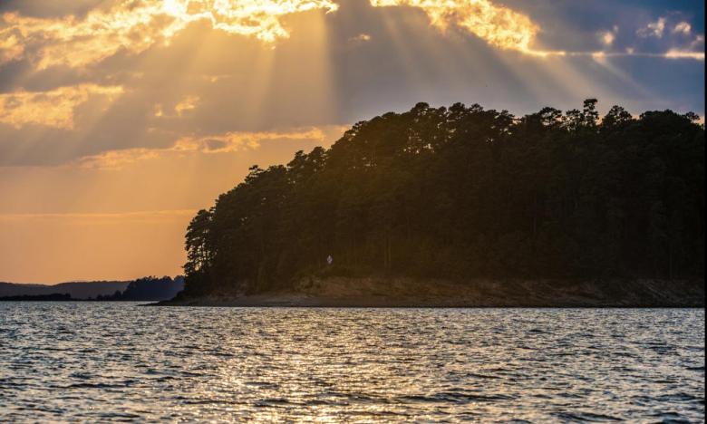 A view of sunbeams on Lake Ouachita.