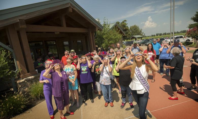 Visitors and staff of the Arkansas Welcome Center in Corning enjoying the partial eclipse in 2017. In 2024, Corning will have nearly four minutes of eclipse darkness.