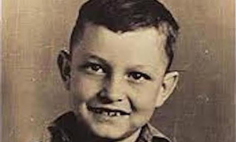 A sepia toned photograph of young Johnny Cash