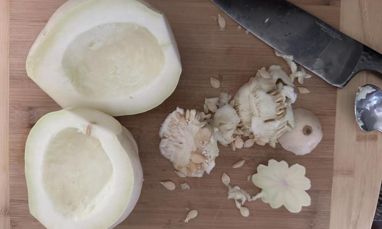 white acorn squash prepped to cook