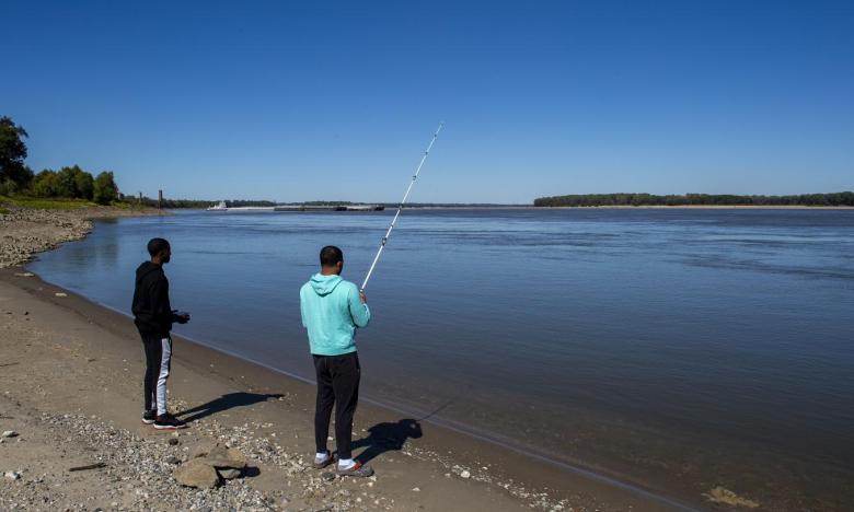 Teens bank fishing at a lake near Osceola, Arkansas