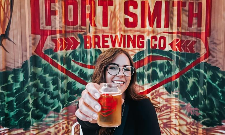 lady holding a beer