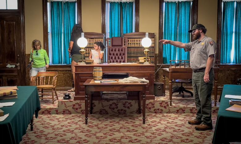 inside an historic home with people in the room