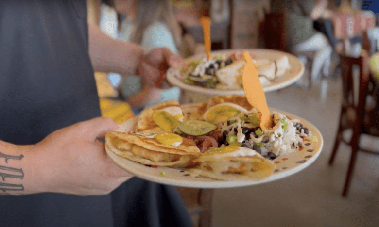 person serving tacos