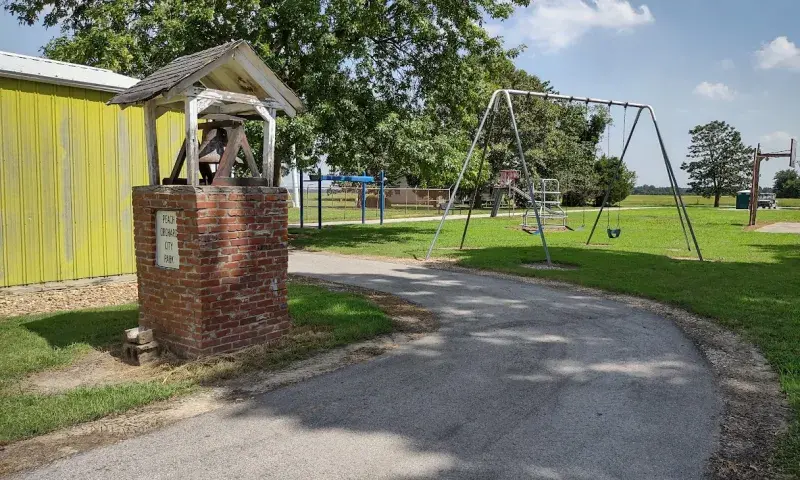 Swing set next to the walking track