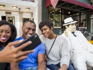 Family selfie with statue of Al Capone in Hot Springs, Arkansas
