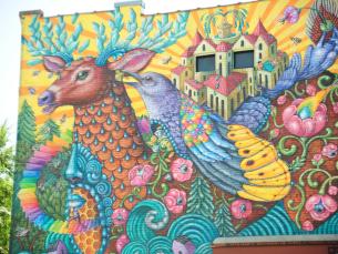Colorful mural on the side of Kollective Coffee + Tea in downtown Hot Springs.