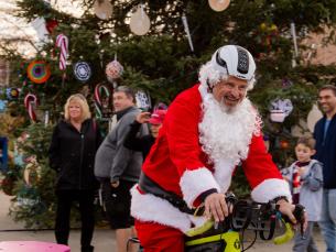 A Cycling Santa in downtown Springdale