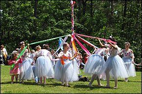 Ballet Dancers teach park guests a Maypole Dance during a Festival