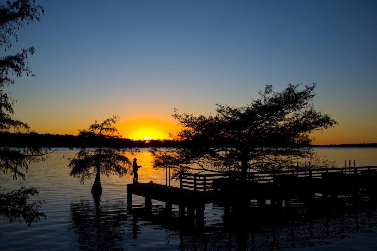 Fishing at Lake Chicot at sunset