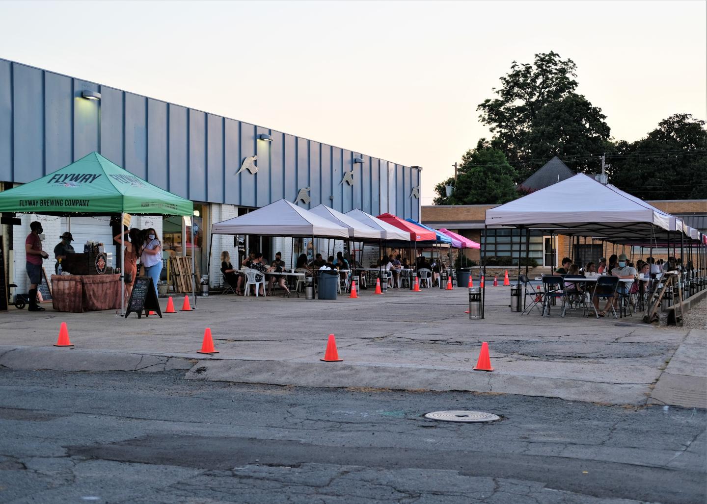 Friends cheering at Flyway Brewing, Beers at Flyway Brewing, Beers at Flyway Brewing, Food at Flyway Brewing, Guy Fierri at Flyway Brewing, Outside of Flyway Brewing