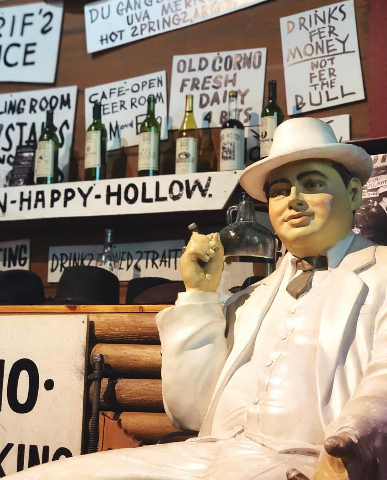 Get your picture taken in front of the world famous Happy Hollow Saloon scene replica in the TGMOA theater.