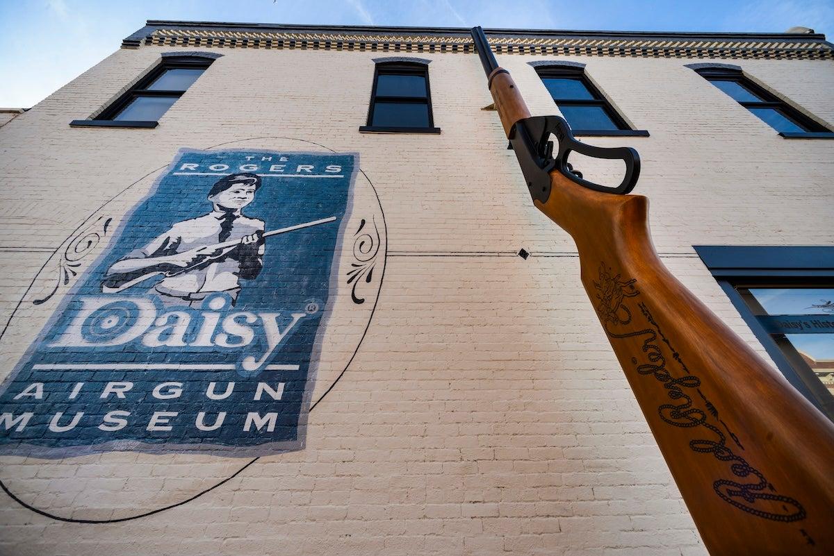 Daisy Airgun Museum exterior with a large rifle sculpture.