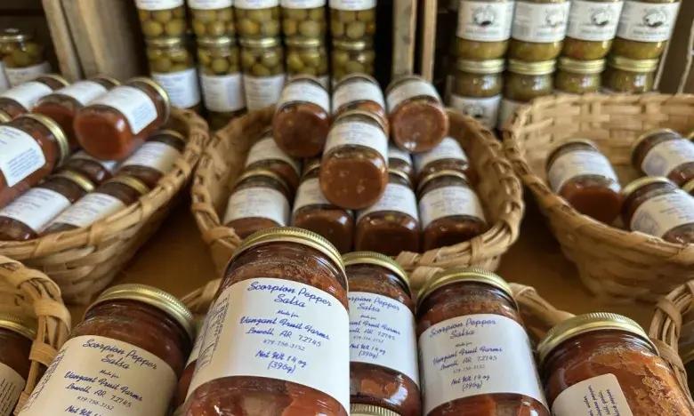 Jars of preserves displayed in wicker baskets.
