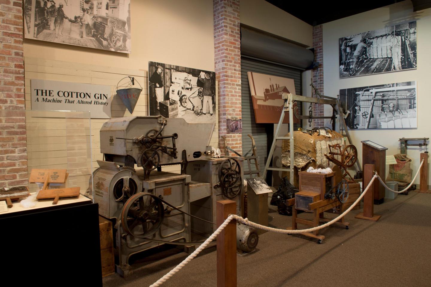Museum exhibit of historical cotton gin machinery.